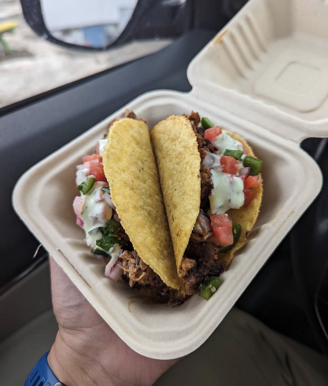 Two soft-shell tacos loaded with seasoned beef, pico, and crema