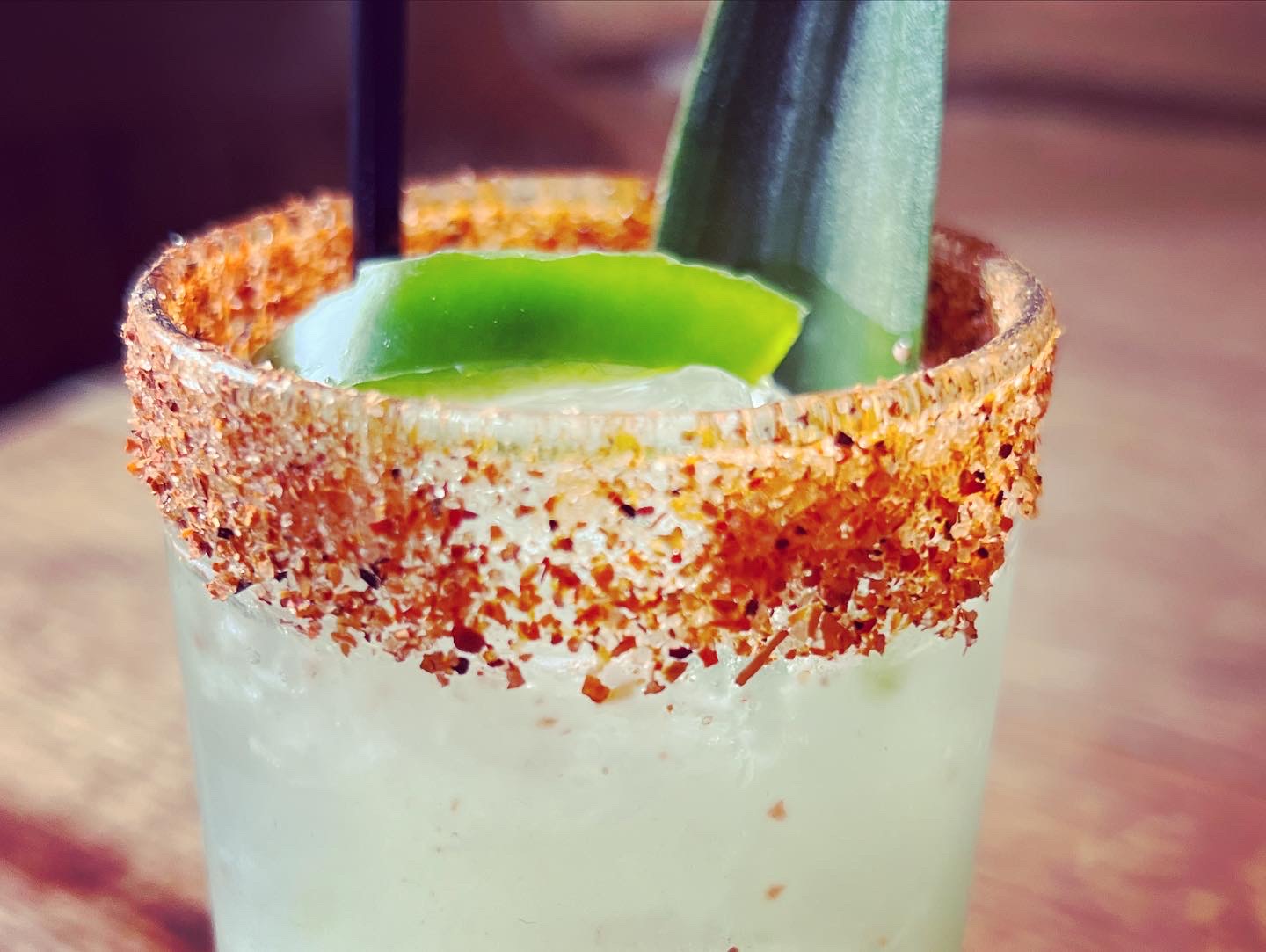 A chili-lime rimmed margarita with cucumber and lime