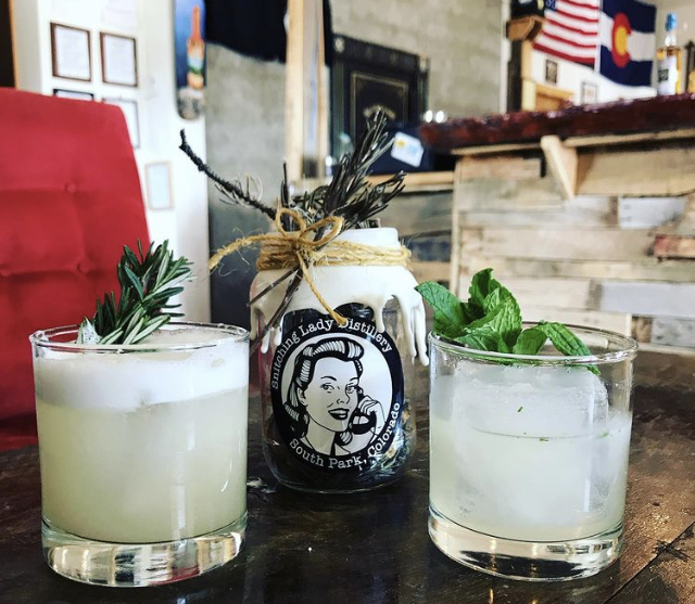 Cocktails on the bar with the Snitching Lady tasting room behind